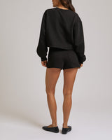 ZIP PKT DOLPHIN HEM HOT SHORTS - JET BLACK